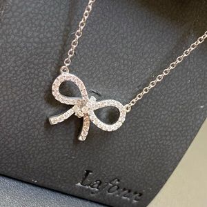 Bow Necklace w/ .48 carrots of man made diamonds